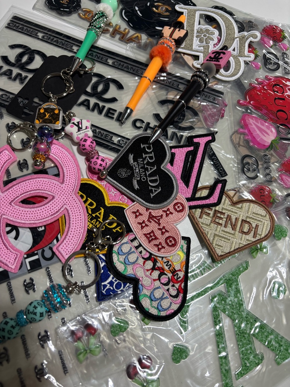 LIVE SHOW 9AM  DECALS, PATCHES, IRON ONS
PENS, KEYCHAINS
